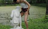 Pissing Outdoor 496084 Statue PissingHot Brunette Peeing In A Garden Of Statues Pissing Outdoor
