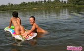 Swing Nudists 498799 Astounding Brunette Chick With A Sexy Tattoo On Her Back Relaxing On Water Swing Nudists
