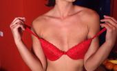 Lingerie Queens 534218 Foxy Dark-Haired Seductively Unclothes Red Lingerie While Posing Lingerie Queens
