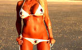 Ember At Home 537651 Ember Reigns Freeones Swimsuit Ember Reigns Poses On The Beach While Wearing A Freeones Swim Suit Ember At Home
