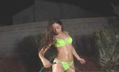 Hennessie.com 548026 Hennessie Lawn SprinklerLong Haired Brunette Plays With A Water Hose Outdoors Hennessie.com
