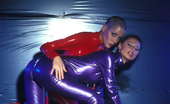 Amsterdam Rubber 550693 Kinky Sluts In Red And Purple Latex Amsterdam Rubber
