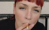 Smoking Divas Redhead Sneaks A Smoke Smoking Divas
