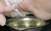 Pee Young 554747 Sexy Redhead Plays With A Steel Bowl And Then Pisses Into It Pee Young
