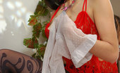 ePantyhose Land 560493 Nell Luscious Hottie In A Red Negligee Sniffs And Changes Into White Dotted Hose ePantyhose Land
