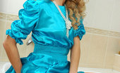 ePantyhose Land 560506 Emilia Blonde Doll In A Baby-Blue Dress Wetting Her Orange Tights In The Bathtub ePantyhose Land
