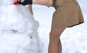 ePantyhose Land 560833 Katrine Stunning Chick In Flesh-Colored Pantyhose Making Snowman In Winter Forest ePantyhose Land
