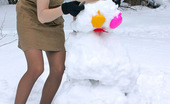 ePantyhose Land 560833 Katrine Stunning Chick In Flesh-Colored Pantyhose Making Snowman In Winter Forest ePantyhose Land
