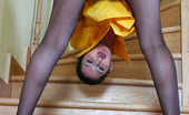 ePantyhose Land 561540 Cora Red Hot Babe In Her Dark Pantyhose Playing With A Dildo Right On The Stairs ePantyhose Land
