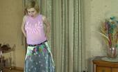 ePantyhose Land 563035 Alina Snow-White Skinned Babe Putting On Her Grey Hose With Barely There Briefs ePantyhose Land
