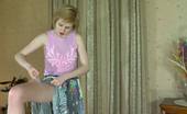 ePantyhose Land 563035 Alina Snow-White Skinned Babe Putting On Her Grey Hose With Barely There Briefs ePantyhose Land

