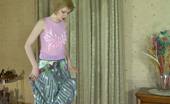 ePantyhose Land 563035 Alina Snow-White Skinned Babe Putting On Her Grey Hose With Barely There Briefs ePantyhose Land
