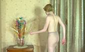 ePantyhose Land 563035 Alina Snow-White Skinned Babe Putting On Her Grey Hose With Barely There Briefs ePantyhose Land
