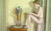 ePantyhose Land 563035 Alina Snow-White Skinned Babe Putting On Her Grey Hose With Barely There Briefs ePantyhose Land
