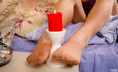 Nylon Feet Line 563925 Lilia Luring Babe Holding A Lit Candle Between Her Nyloned Feet With Painted Toes Nylon Feet Line
