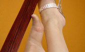 Nylon Feet Line 563948 Bunny Upskirt Gal Rubbing Her Feet In Hose And Spike Heels Against A Wooden Pole Nylon Feet Line
