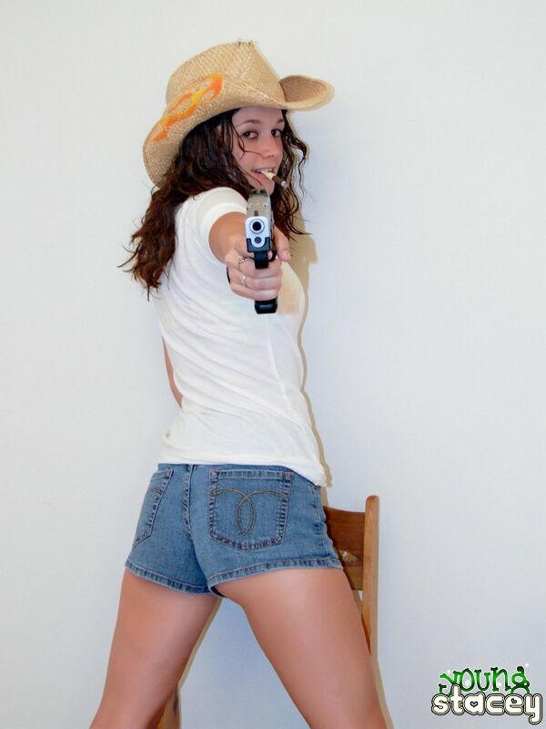 Young Stacey 569185 Frizzy Haired Young Cowgirl Stacey Playing Naked With A Gun On The Chair Young Stacey