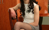 Nylon And Toys 572728 A Brunette In Black Pantyhose And Boots Poses On The Chair With A Dildo
