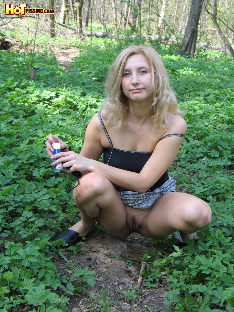 Hot Pissing Open-Air Pee Stream Blonde Girl In A Mini And A Top Decides To Make A Pee In The Open Air 419716